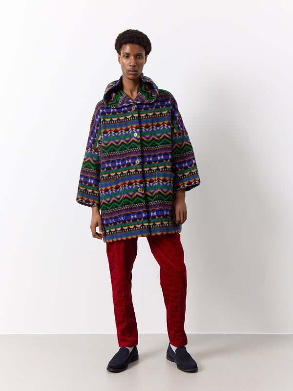 This high-quality Missoni wool coat stands out as a unique piece. Its duffle style, heavy wool, and warm design make it the perfect winter coat. The bright bold print, deep front pockets, and drop shoulder style add to its long silhouette and practicality.