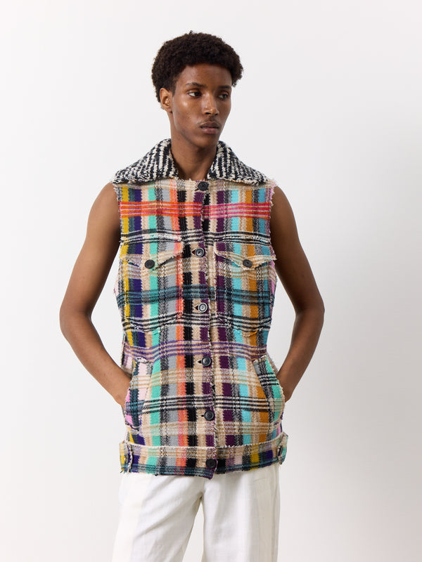 This Missoni wool vest boasts a rare, thick fabric with a unique, wide collar, practical front pockets, and a classic front button. A distinct contrast check detail adds a touch of style to the overall design, which features a long, flattering shape.