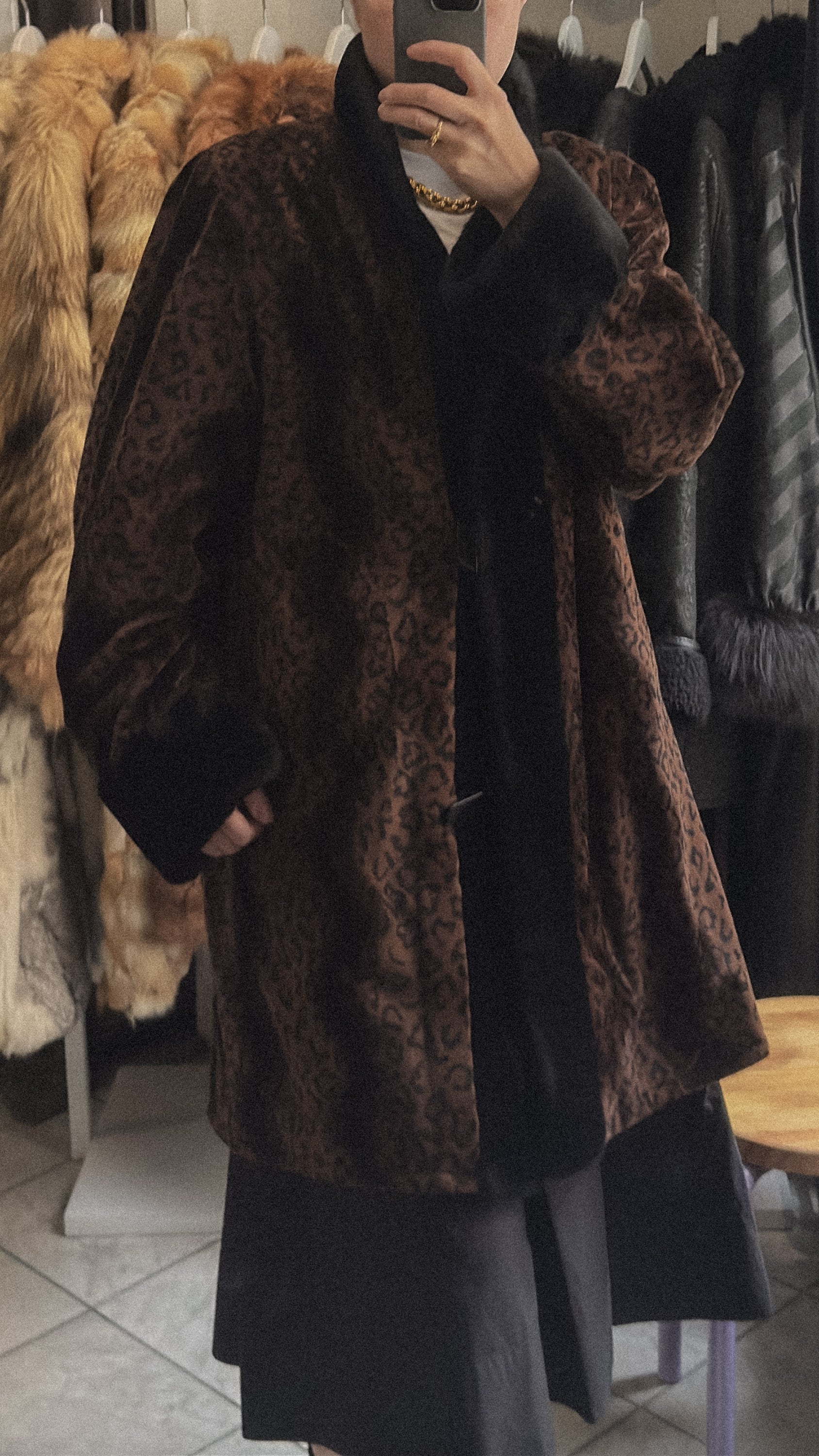 Vintage reversible coat with faux fur collar and cuffs, button front, and pockets. Elegant silhouette in very good condition.