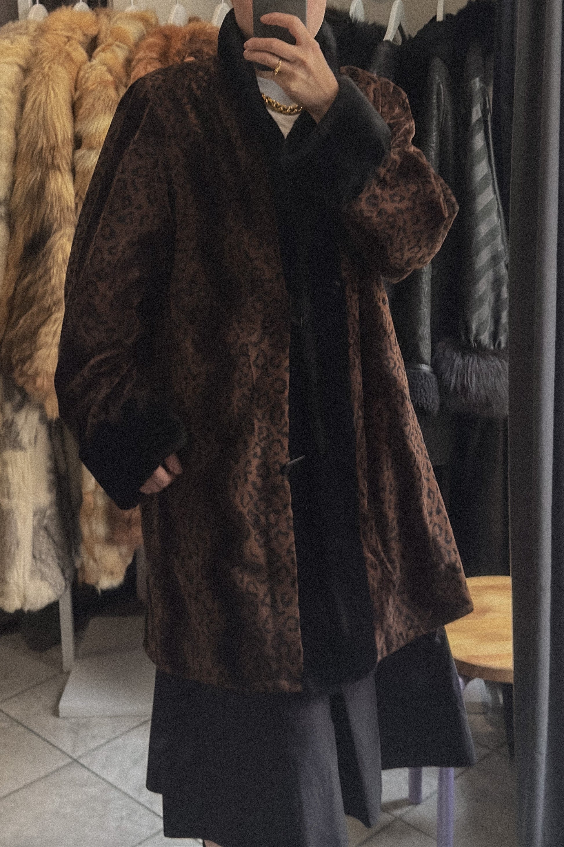 Vintage reversible coat with faux fur collar and cuffs, button front, and pockets. Elegant silhouette in very good condition.
