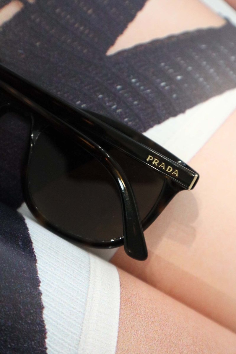 Prada Minimalist Cat Eye Sunglasses - WILDE