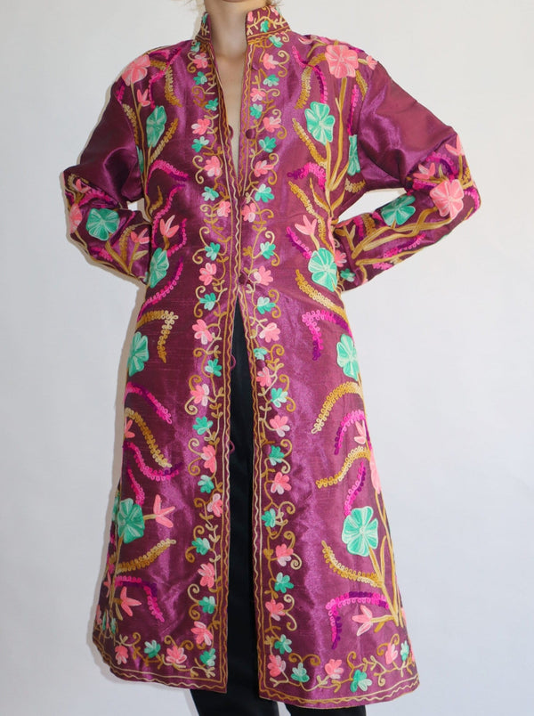 Stunning fully embroidered robe dress. Pure silk, lined in a fit and flare slim silhouette. Fully hand floral embroidery on sleeves and back.
