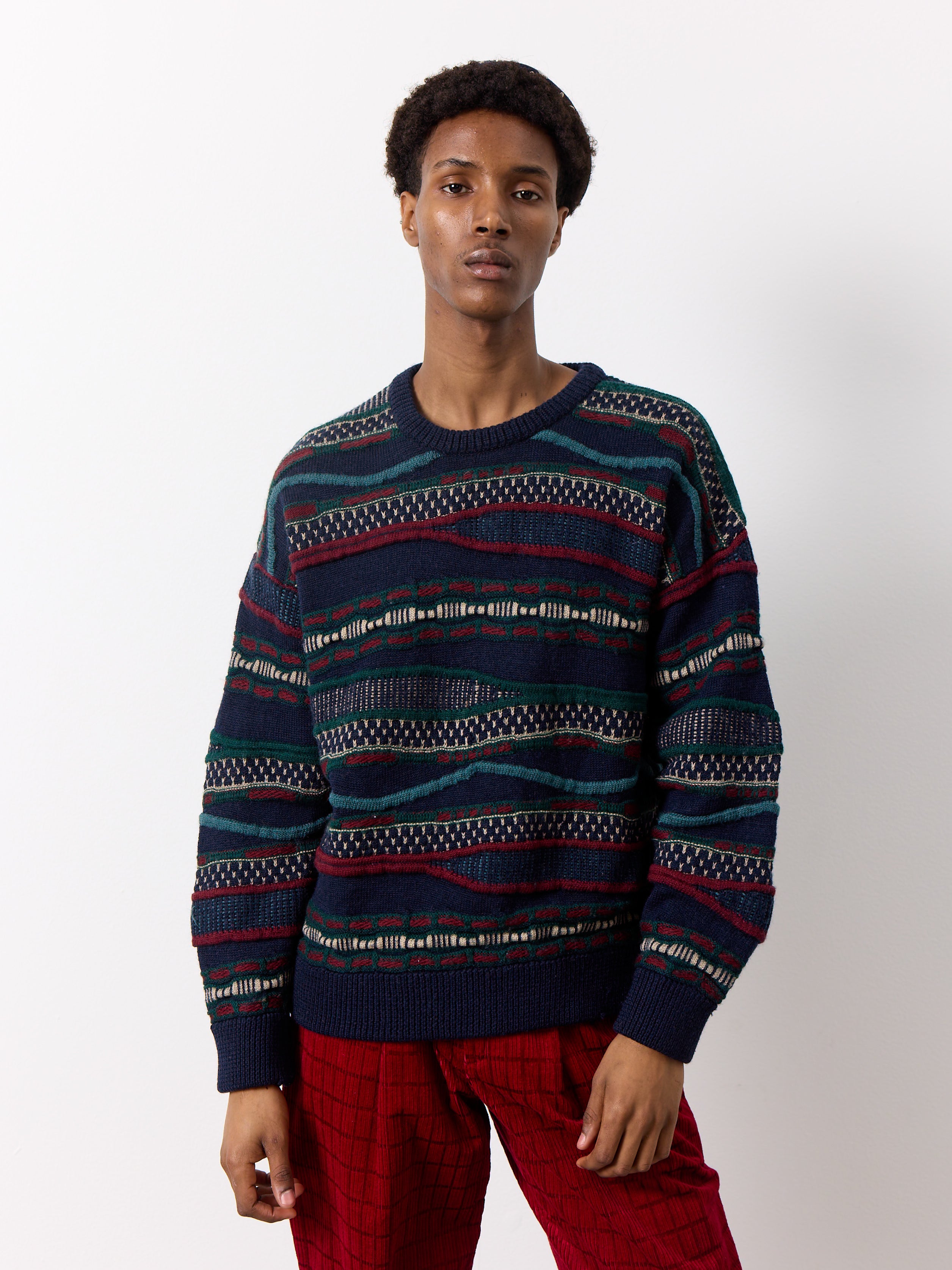 Expertly crafted knit sweater featuring a timeless Coogi-inspired design. The thick, three-dimensional knit adds a touch of boldness to this minimalist piece.