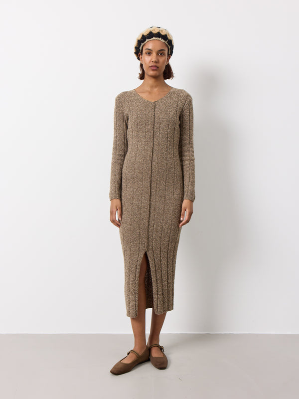 Soft long knitted wool dress. Soft stretchy feel, long sleeves, front split. Minimalist design with Y2K energy, perfect for understated coolness.