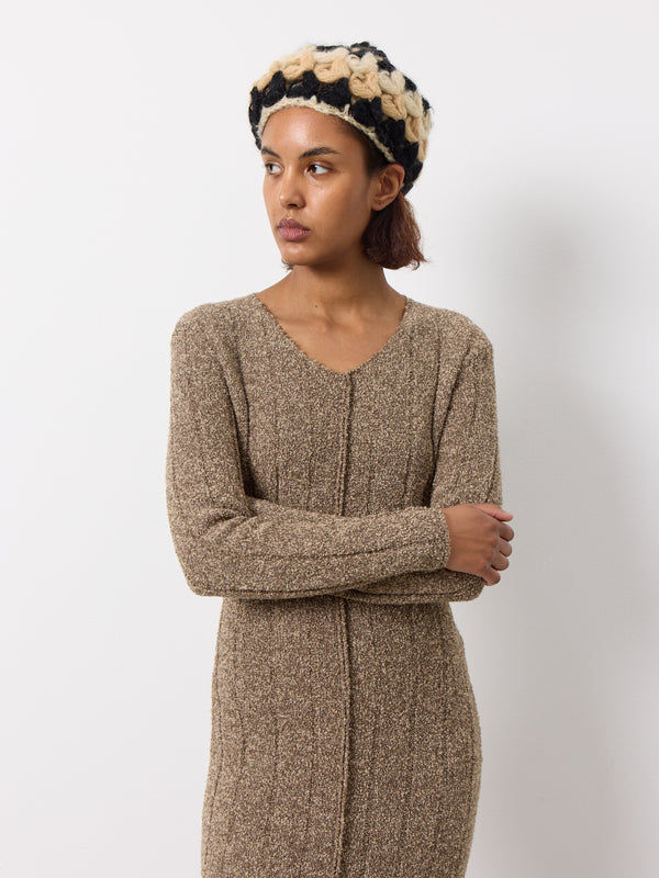 Soft long knitted wool dress. Soft stretchy feel, long sleeves, front split. Minimalist design with Y2K energy, perfect for understated coolness.