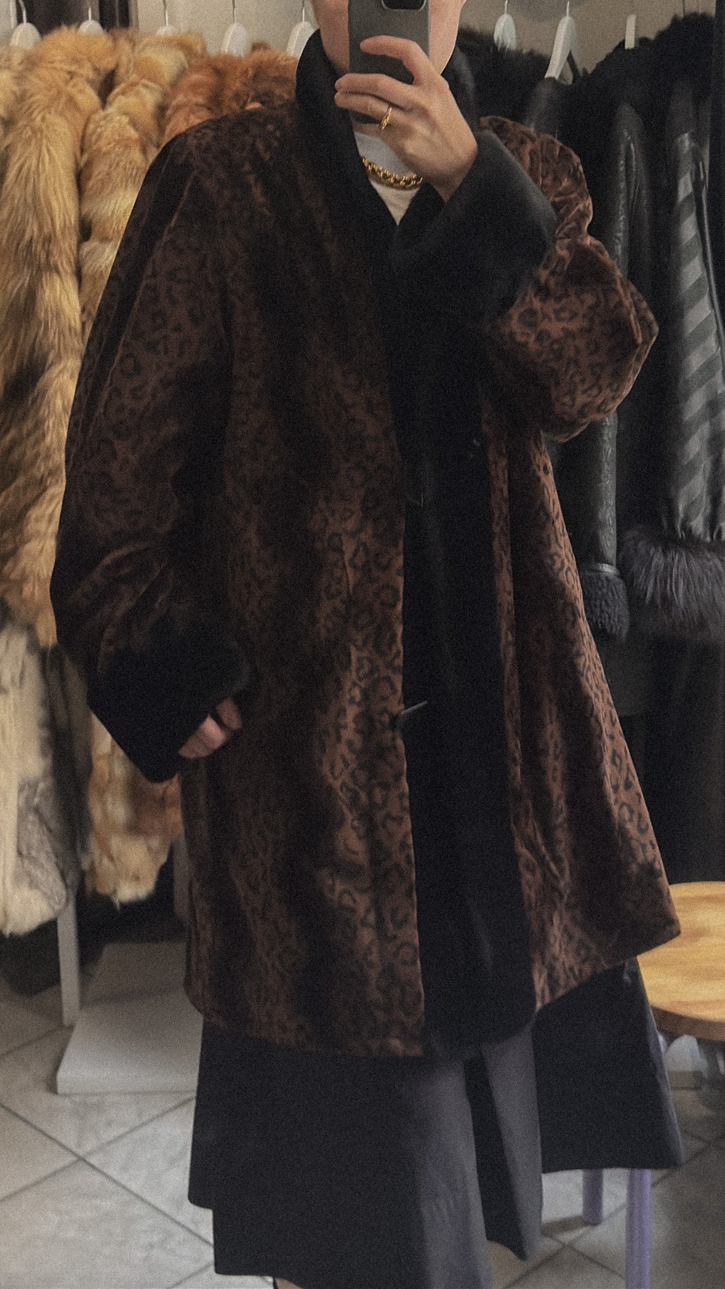 Vintage reversible coat with faux fur collar and cuffs, button front, and pockets. Elegant silhouette in very good condition.