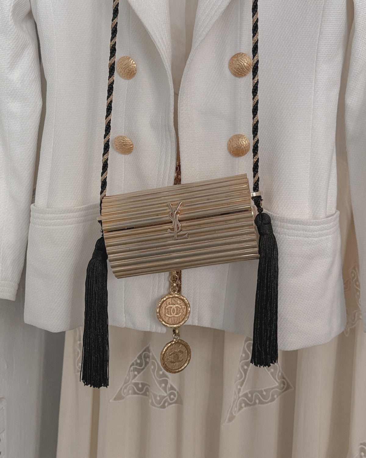 Vintage Yves Saint Laurent Gold Gilt Tassel Minaudiere and Chanel jacket photographed in WILDE Vintage Designer Shop, central Copenhagen