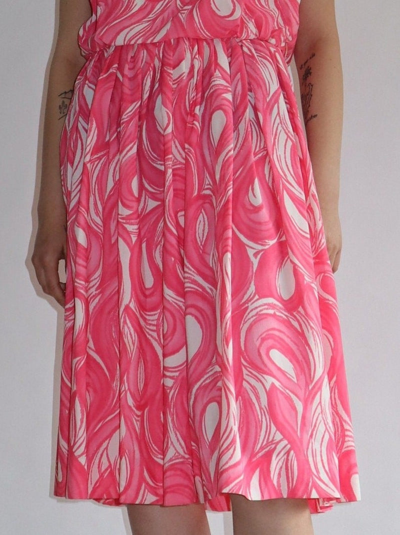 Beautiful soft pink swirl summer dress. Zipped back, lined, with a pleated skirt.  All the items we sell are authentic vintage and one-of-a-kind. You will receive the exact item photographed.  Best fits women: small