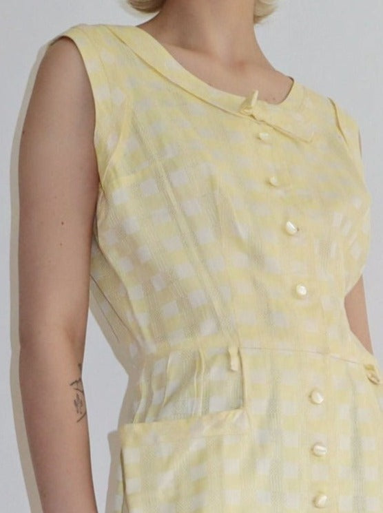 Super cute vintage lemon checked bow front button summer dress. Collared bow with tailored details. Pearl button front with side pockets. Lovely soft checked cross fabric.