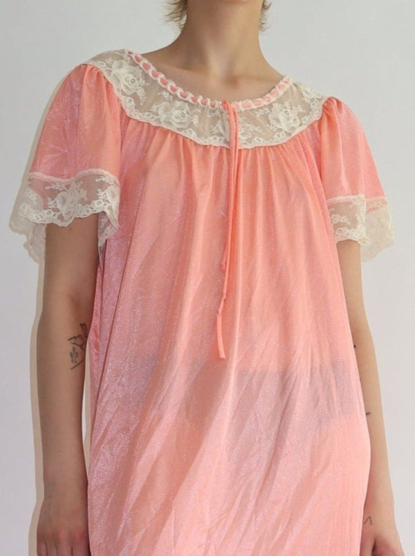 Soft pink and lace ruche with a ribbon tie. Lace hem sleeves, a relaxed lingerie slip dress.  All the items we sell are authentic vintage and one-of-a-kind. You will receive the exact item photographed.  Best fits women: small