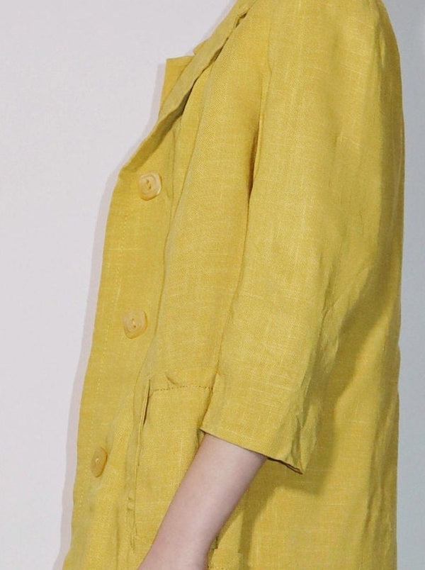 Lovely yellow linen coat, fully lined. Classic collar with pockets and button front. Duster coat aesthetic in a slim silhouette.