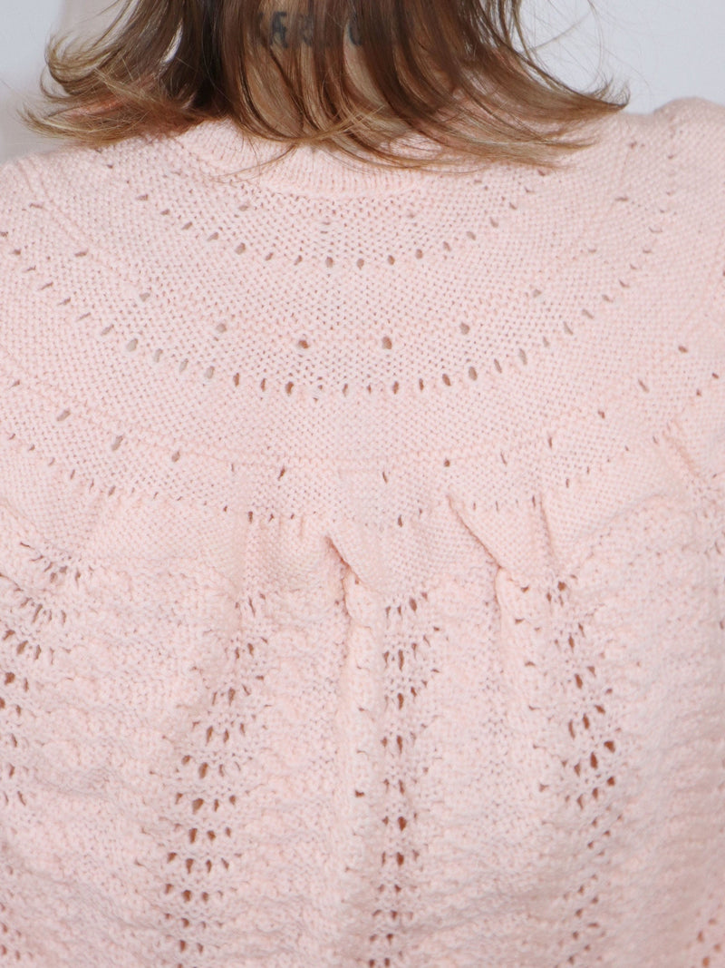 Hand-knit coral crop cardigan. Soft knit details, open front, bell sleeves, and back.