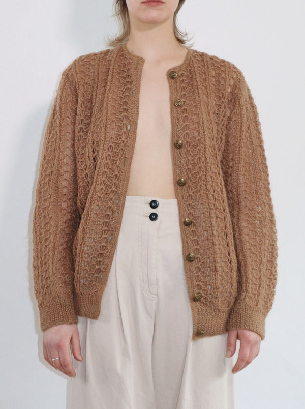 Hand-knit mohair and wool cardigan. Crew neck, metal button front in a relaxed fit.