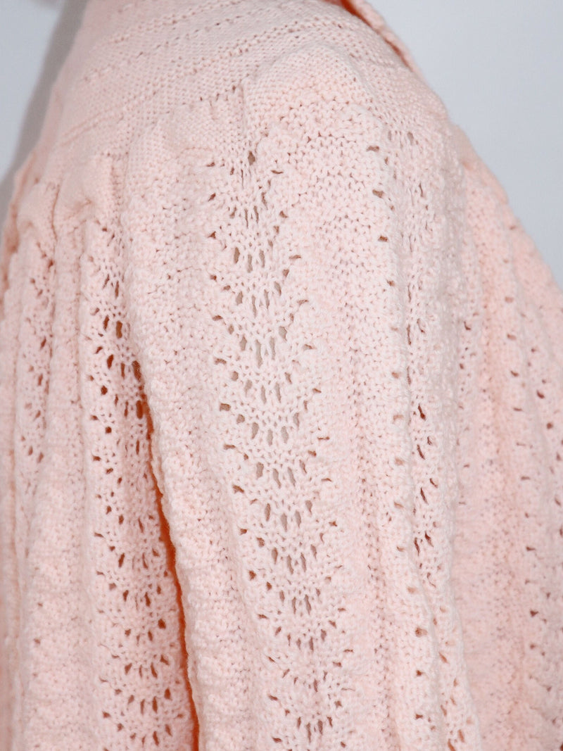 Hand-knit coral crop cardigan. Soft knit details, open front, bell sleeves, and back.