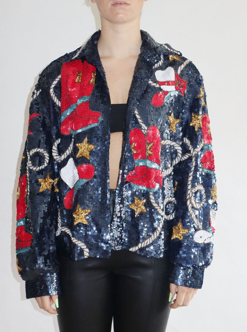 This statement sequin Americana jacket is a rare and exquisite find - fully lined with open front styling and the perfect touches of cowboy lasso, stars, and cowboy hats!