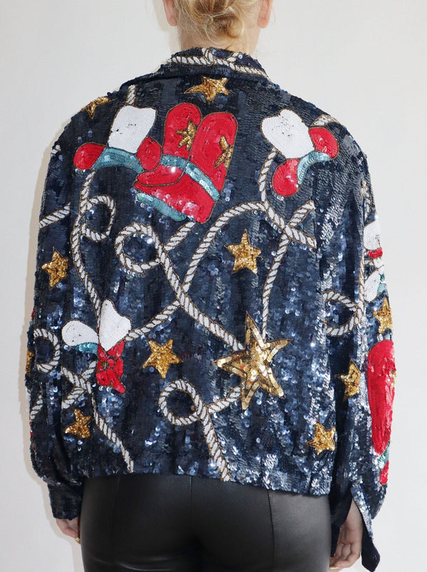This statement sequin Americana jacket is a rare and exquisite find - fully lined with open front styling and the perfect touches of cowboy lasso, stars, and cowboy hats!