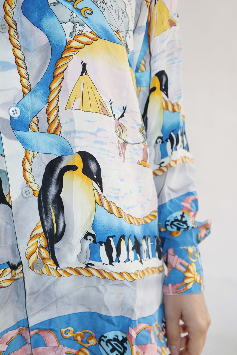 Gorgeous vintage silk shirt featuring a striking pastel print of penguins. Sumptuous silk fabric, ideal for adding pizzazz to any occasion!