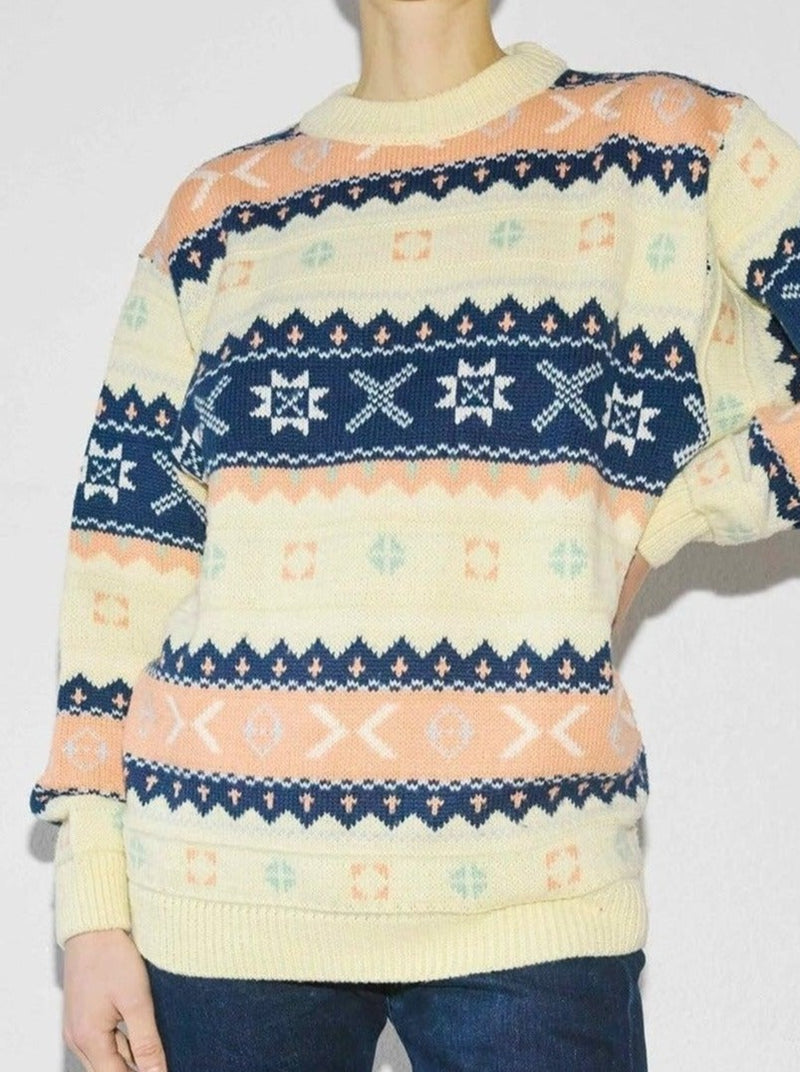 This timeless pastel fair isle knit sweater has a touch of 90s style, and a comfortable relaxed fit, making it a must-have for any wardrobe. The intricate Nordic pattern adds a unique touch to this rad piece.